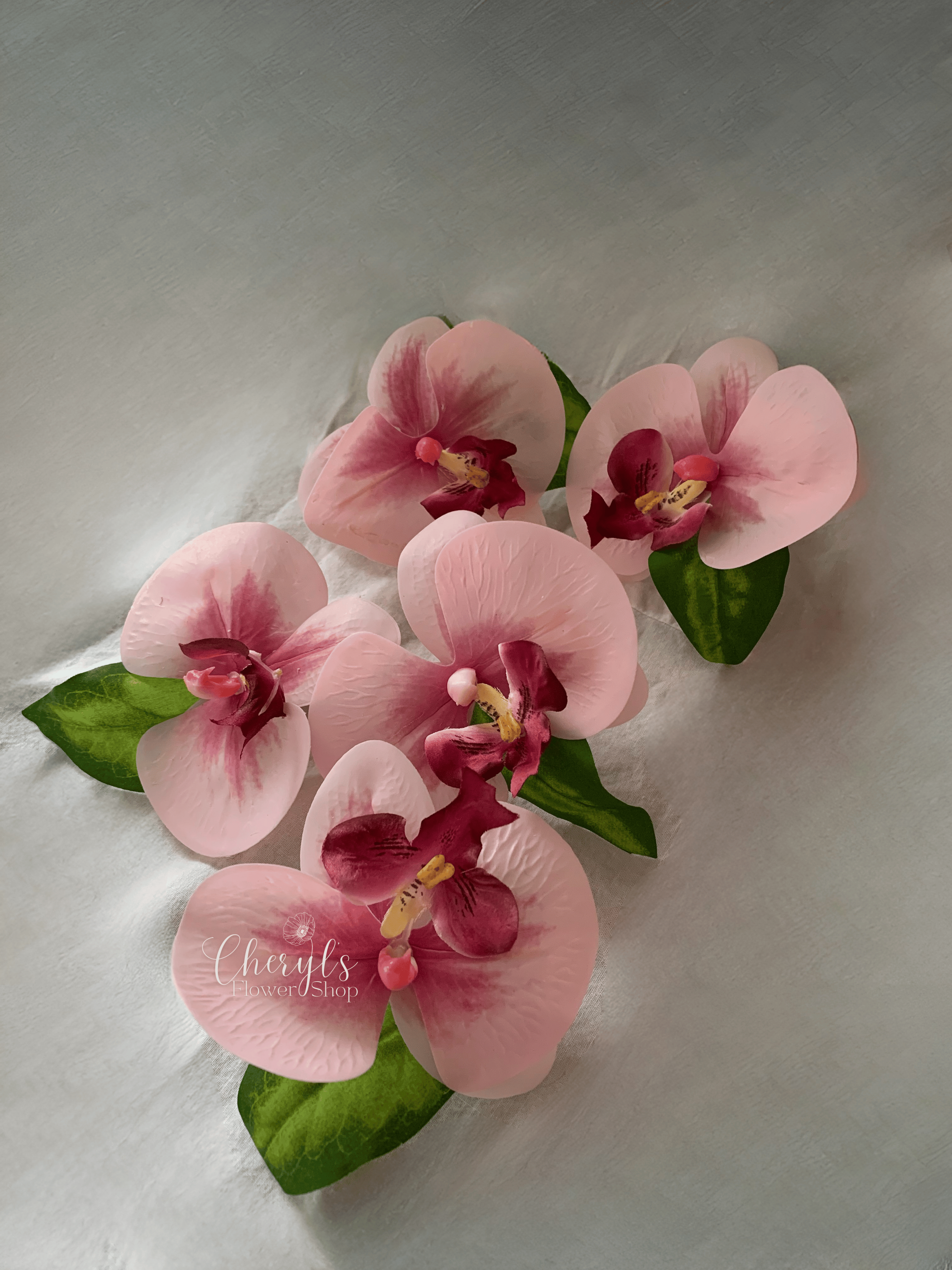pink silk flower wedding boutonnieres